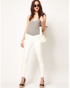 J Brand J Brand 811 Mid Rise Skinny Jean in Creamy White - Lyst