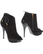 Versace Ankle Boots - Lyst