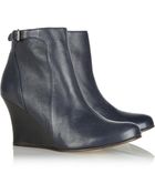 Lanvin Buckled Leather Wedge Boots - Lyst