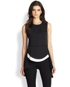 BCBGMAXAZRIA Draped Splitback Peplum Top - Lyst