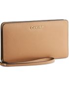 Calvin Klein Scarlett Zip Around Saffiano Leather Portfolio Wristlet - Lyst