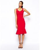 Hybrid Pencil Dress With Wrap Front And Peplum Hem - Lyst