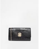 Dune Embossed Snake Clutch Bag - Lyst