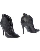 Guess Shoe Boots - Lyst