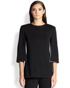 St. John Leather-Trimmed Wool Top - Lyst