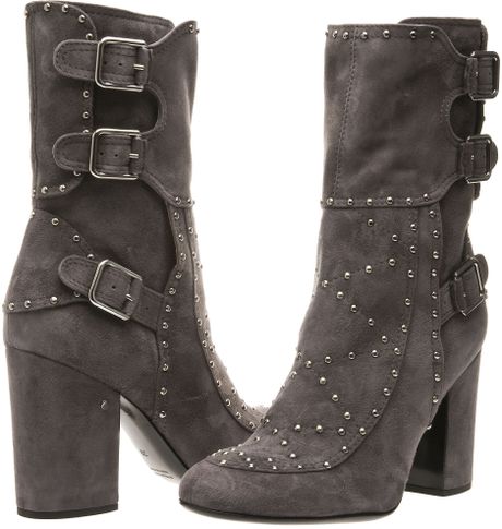 gray boots with buckles
