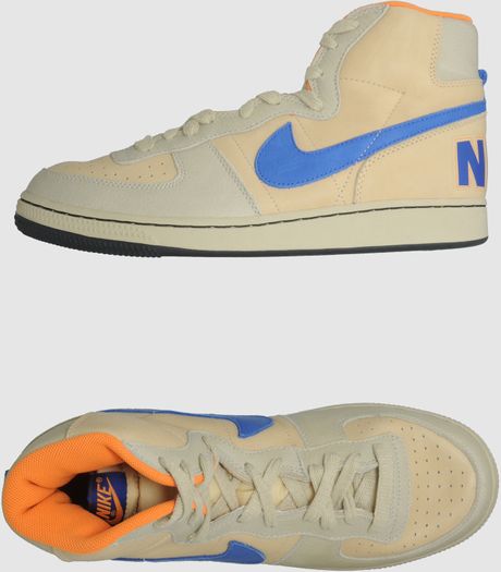 beige white and black nikes