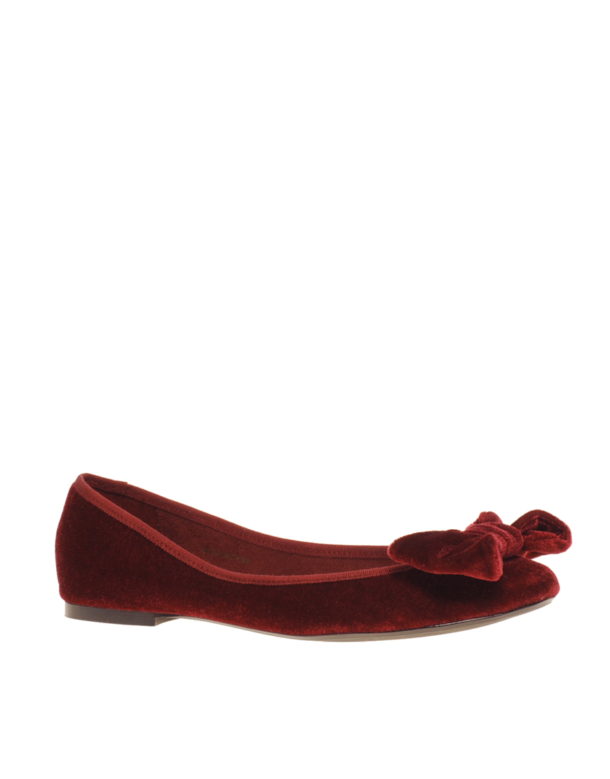 red flat shoes with bow