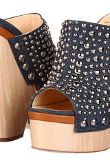 Giuseppe Zanotti Denim upper. Open toe. Studded hardware throughout the vamp.