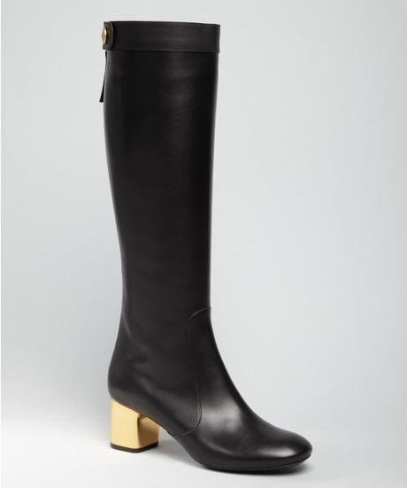 black and gold high heel boots