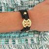 Tory Burch Logo Skinny Double Snap Cuff in Black - Lyst