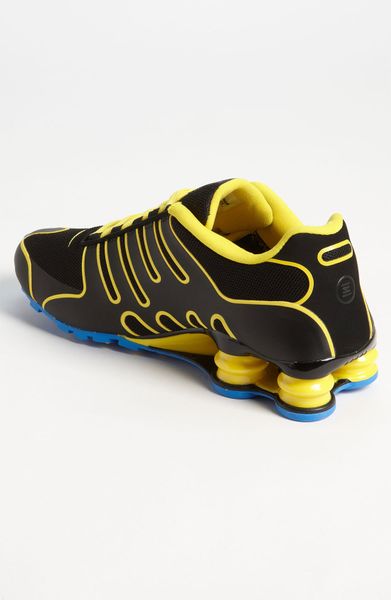 nike shox black yellow