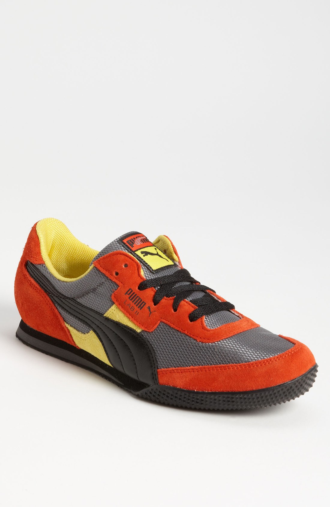 puma black and orange sneakers