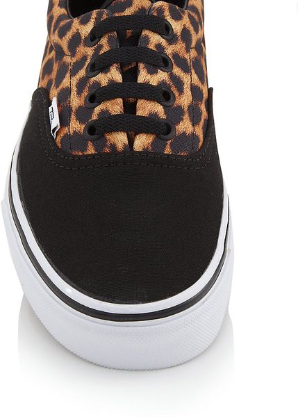 leopard and black trainers