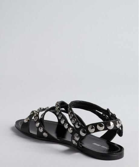 Miu Miu Black Studded Leather Gladiator Flat Sandals in Black | Lyst