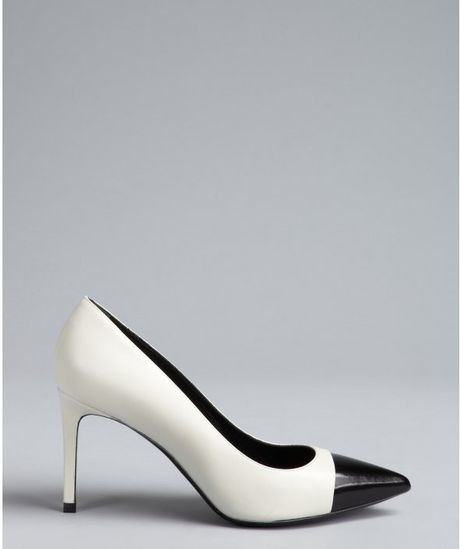 black pumps with white cap toe