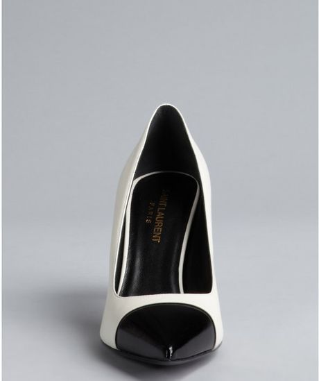 black pumps with white cap toe