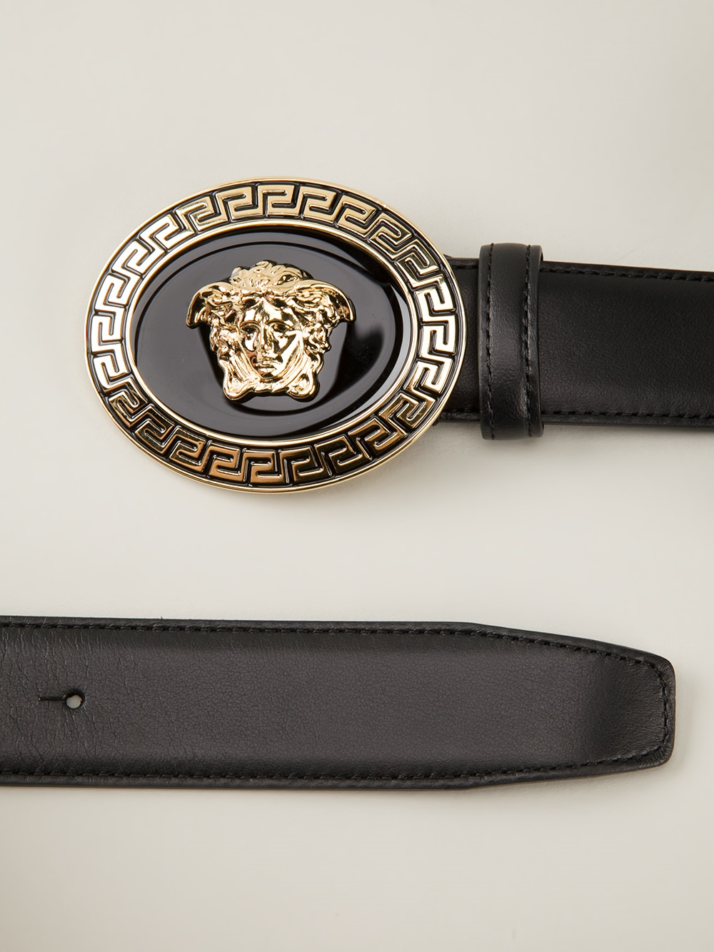 Black leather belt from versace featuring a gold-tone o   val medusa ...