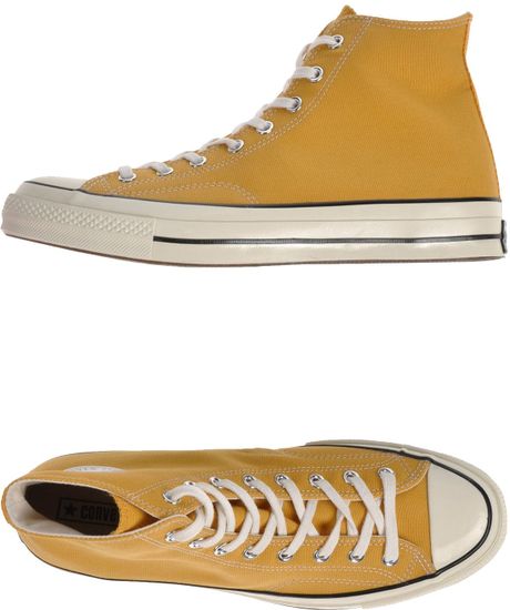black and yellow leather converse