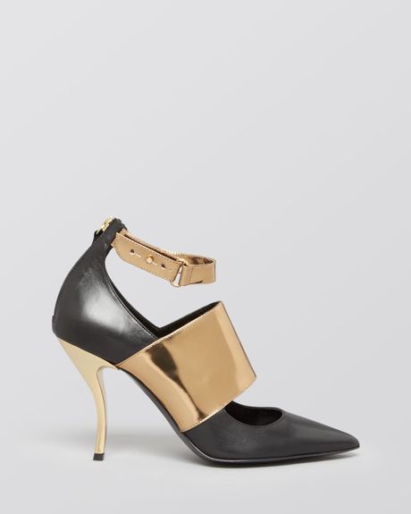 black heels with gold toe