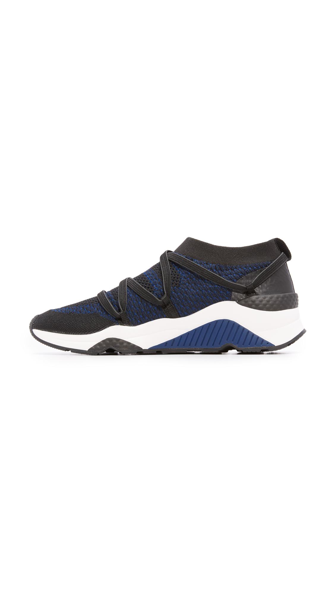 straps crisscross the knit sock on these sporty ash sneakers