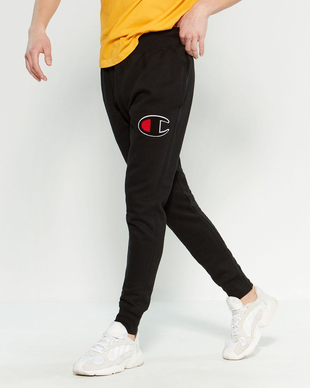 champion joggers logo all over