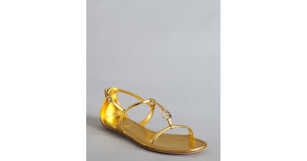 Lyst - Gucci Gold Metallic Leather Logo Charm Strappy Sandals in Metallic