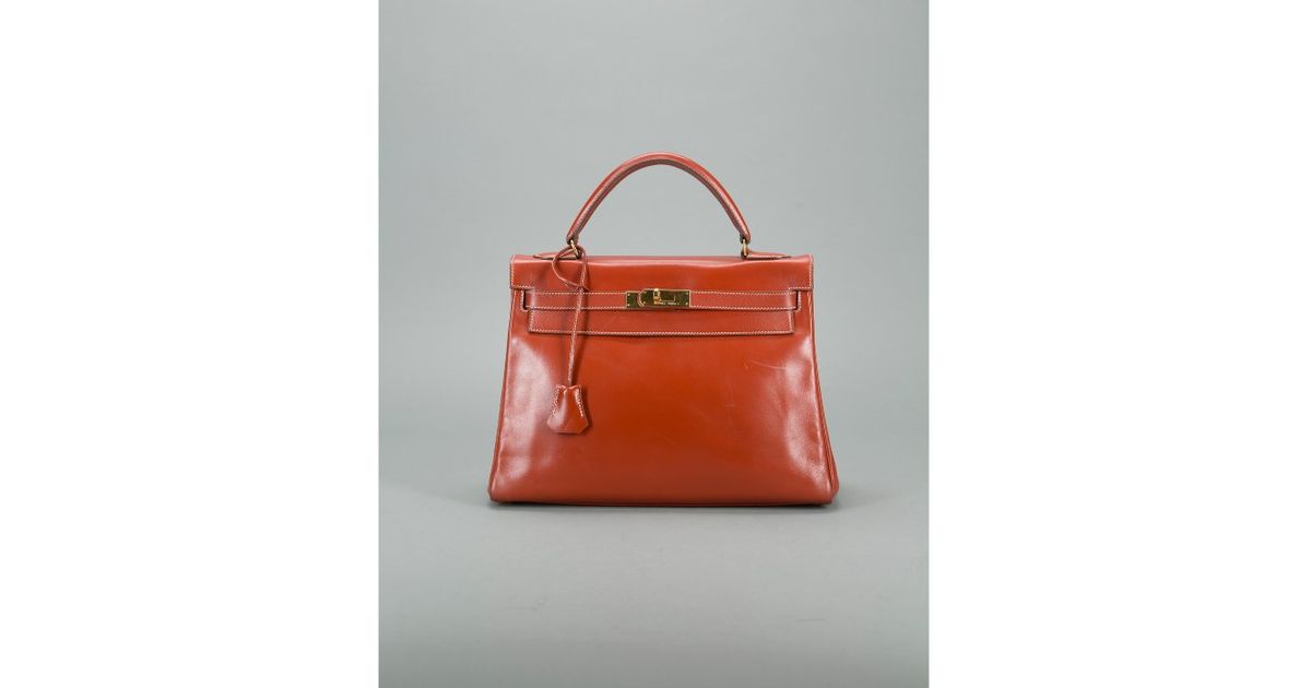 Herms Preowned Brique Retourne Box Calf Kelly 32cm Bag in Red | Lyst