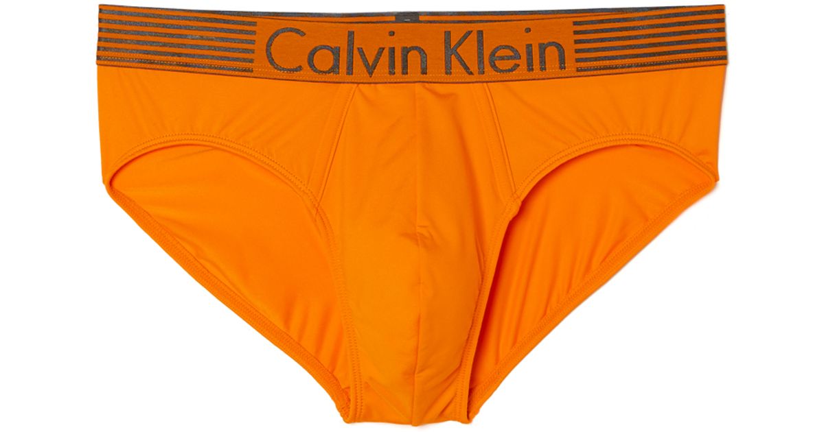 Calvin Klein Iron Strength Hip Briefs In Orange For Men Lyst