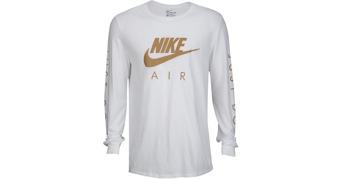 white & gold nike shirt