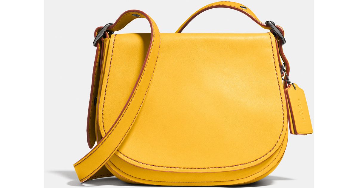 Lyst Coach Saddle Bag 23 In Glovetanned Leather Yellow