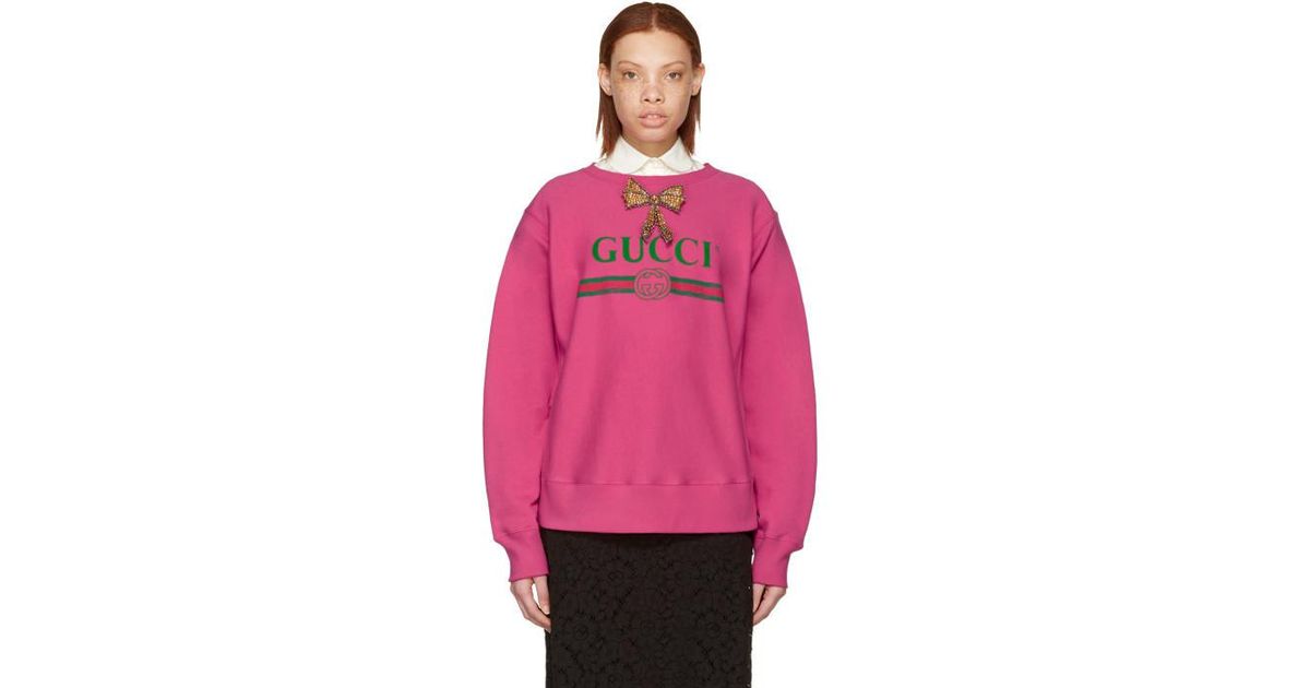 pink gucci sweater with green bear