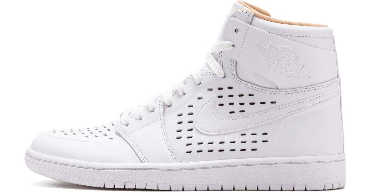 tan and white nikes