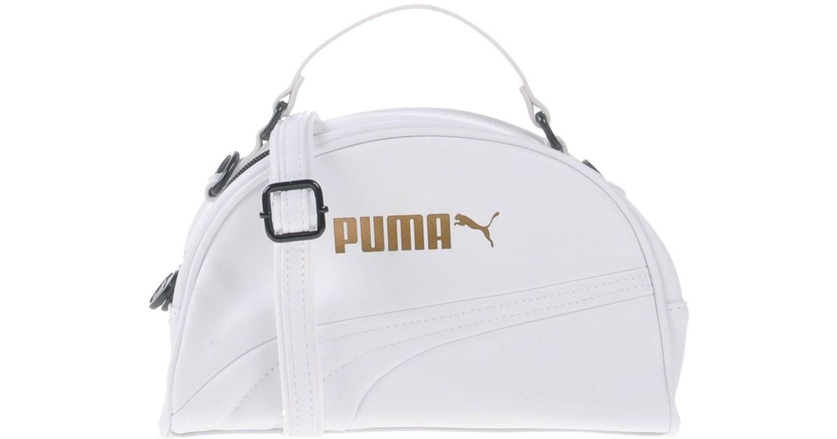 white and gold puma handbag