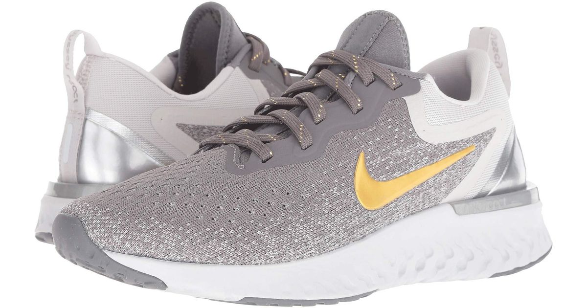 Nike Multicolor Odyssey React Premium (gunsmokemetallic Goldvast Grey) Women's Running Shoes Nike Multicolor Odyssey React Premium (gunsmokemetallic Goldvast Grey) Women's Running Shoes