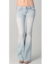 destroyed flare jeans