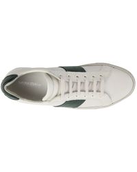 white sneakers with stripes