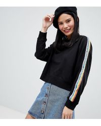 Unique - Sweat-shirt à imprimé arc-en-ciel Monki en coloris Black