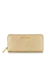 Michael Kors - Metallic Jet Set Travel Pale Gold Saffiano Leather Continental Wallet - Lyst