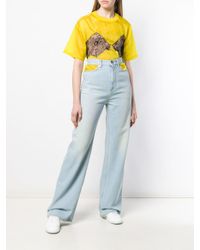 Jean ample à découpes Maison Margiela en coloris Blue