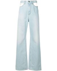 Jean ample à découpes Maison Margiela en coloris Blue
