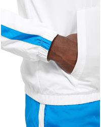 nike tech tracksuit light blue