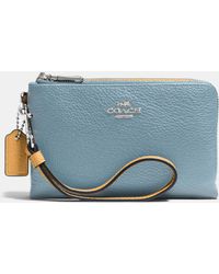 coach wristlets ad-hoc