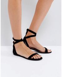 kurt geiger black flat sandals