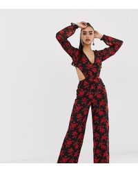 Missguided Tuta jumpsuit nera a fiori con apertura sul retro e ruches - Nero