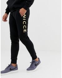 Skinny Sweatpants In Black With Gold Logo Skinny Sweatpants In Black With Gold Logo