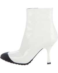Shop Women's Miu Miu Boots from $39 | Lyst