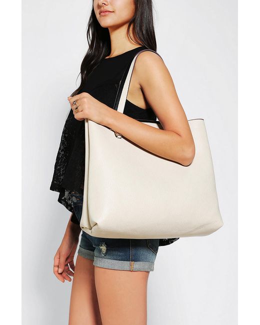 Urban outfitters Reversible Vegan Leather Tote Bag in Black (BLACK/IVORY) | Lyst