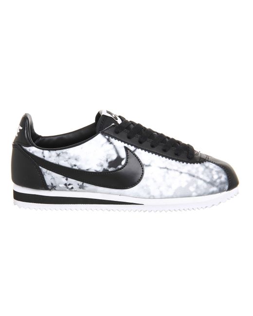 gray and black nike cortez
