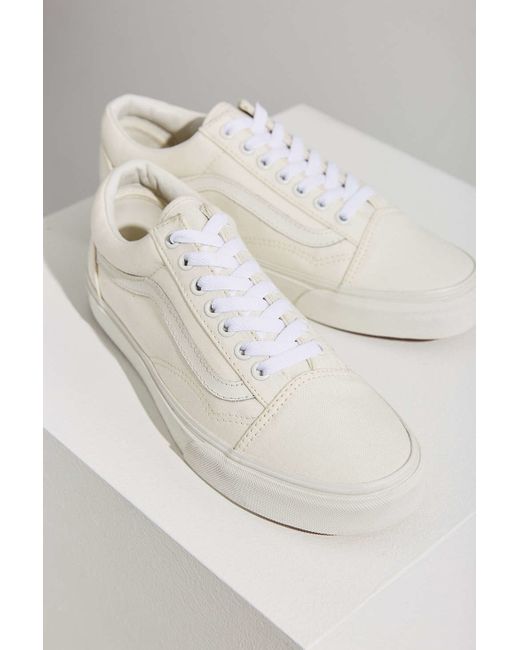 cream colored old skool vans